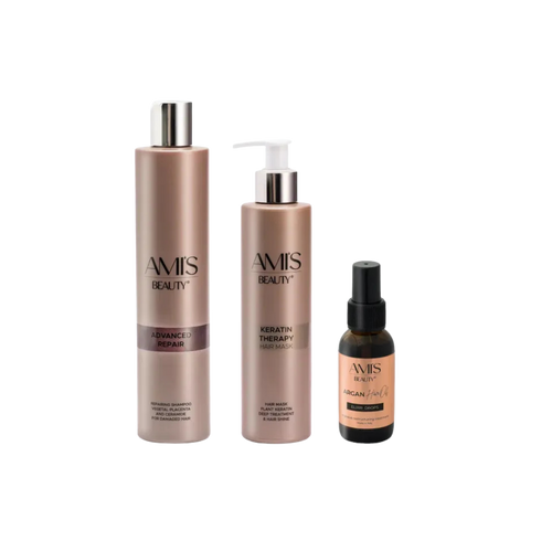 Three-piece Extra Repair Set featuring advanced repair shampoo, a keratin mask, and argan hair oil in brown and bronze tones, isolated on a white background.