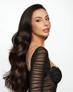 Three-piece Extra Volumizing Boost Set featuring shampoo, volume boost fluid, and argan hair oil in brown and bronze tones, isolated on a white background.
